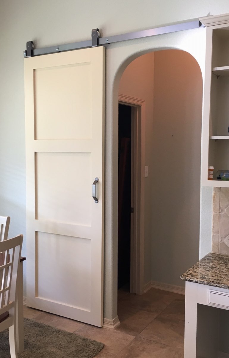 Quaker style barn door in Bluff City kitchen.